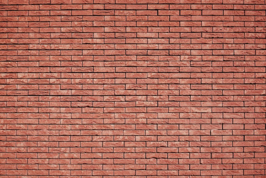 Image shows a brick wall to illustrate overcoming writer's block.